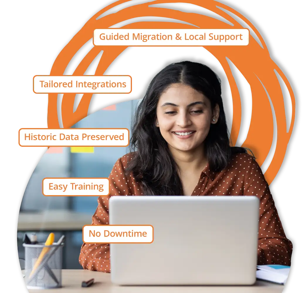 Image of a woman on a laptop computer smiling.